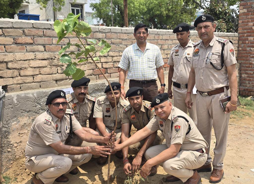Message of environmental conservation delivered Superintendent of Police Vinod Kumar planted saplings with villagers and police personnel